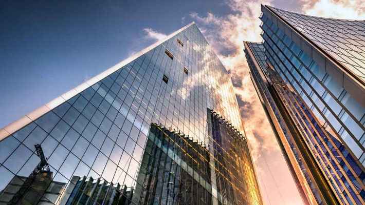Real estate high rise glass building view from bottom