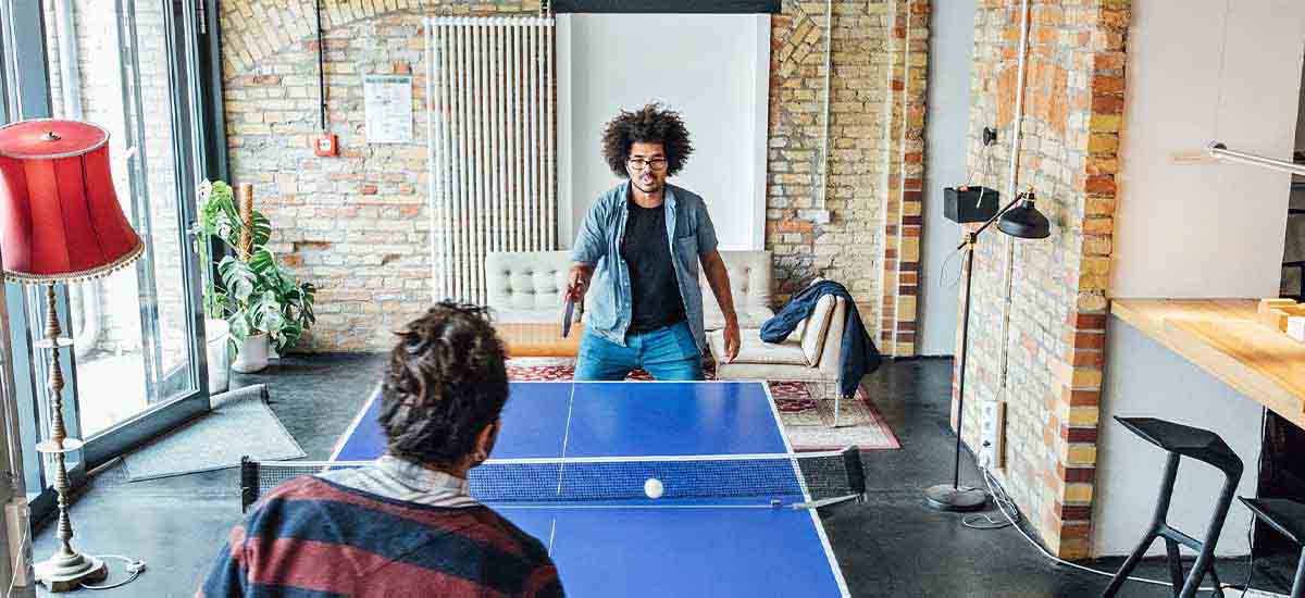 businessmen playing table tennis