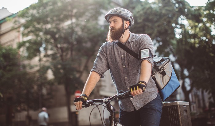 Man delivering the parcel on his bicycle