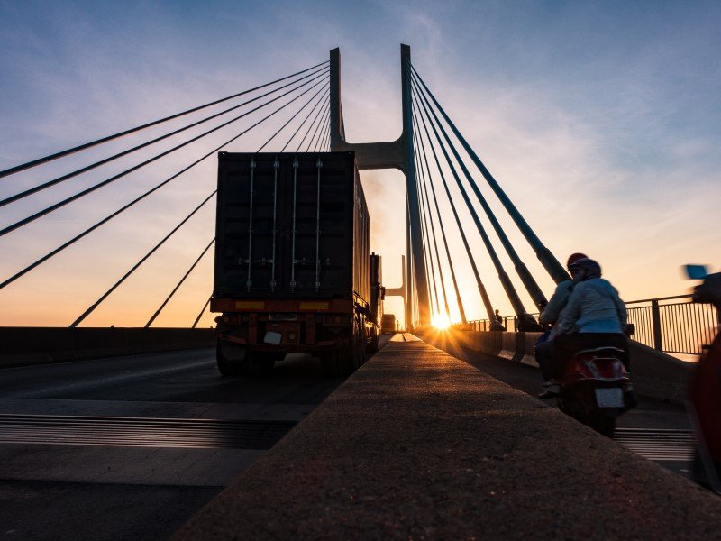 Beautiful sunrise view of Vasco da gama bridge with vehicles