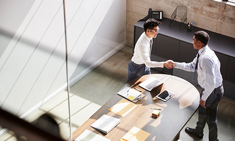 Two employee shaking hand