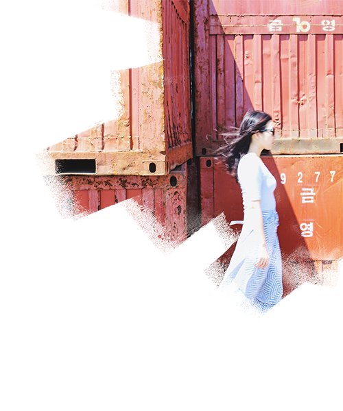 Portrait of Woman walking towards the logistic warehouse