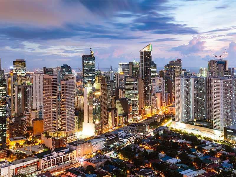 Aerial view of city landscape with lots of skyscraper buildings