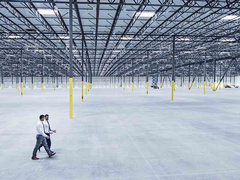 Men walking inside the warehouse