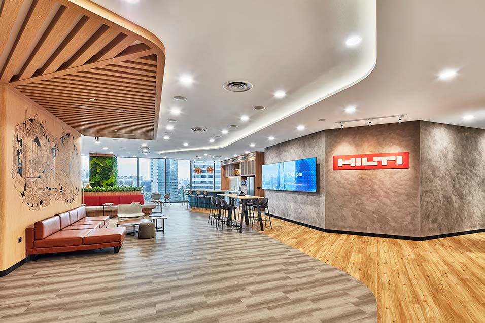 Spacious lounge area with various seating at Hilti Singapore’s office