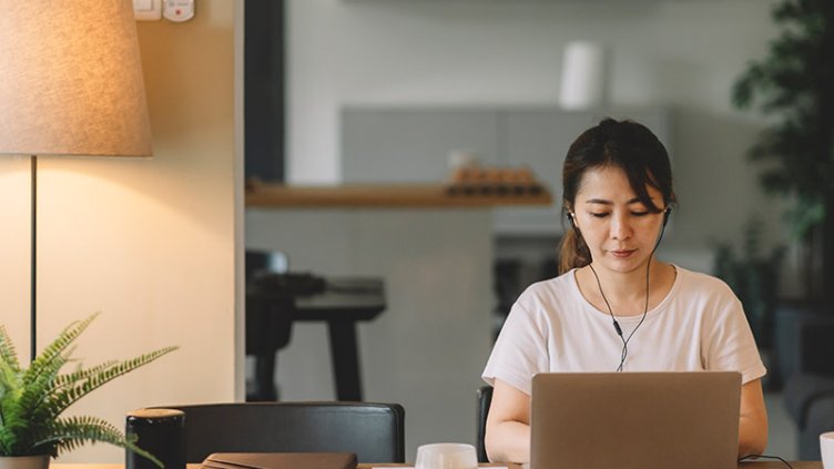 A Woman working on Laptop