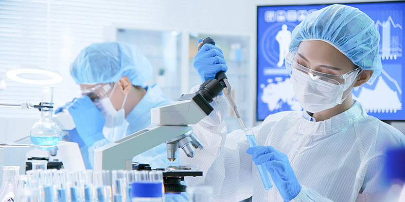 Asian scientist doing experiments using test tube 