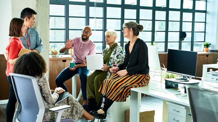 Diverse team brainstorming in bright and relaxed office space