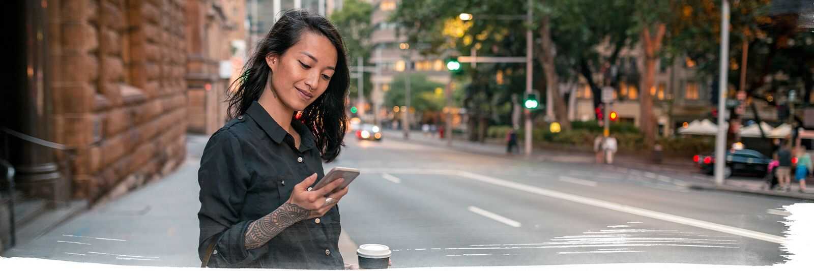 Girl smiling and looking at the mobile