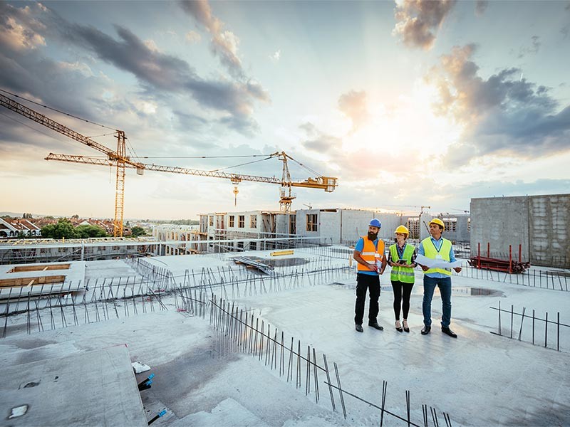 Construction engineers working on site