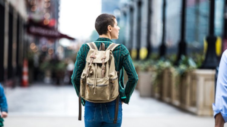 Young man carrying backpack