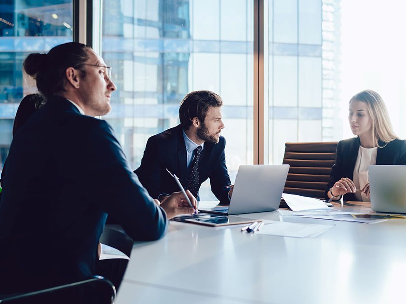 Employees discussing at meeting room